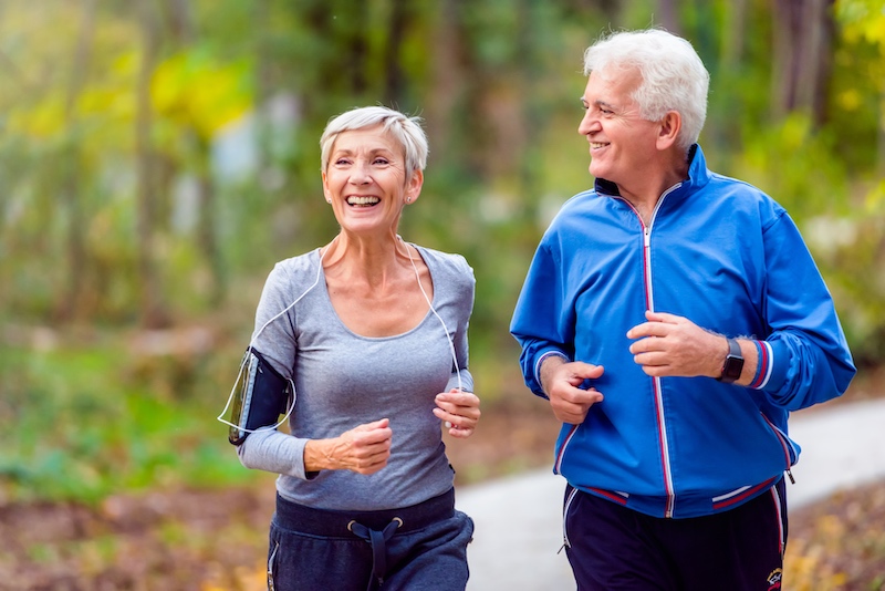 Smiling couple jogging in the park
